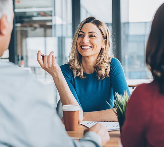 Homeowner meeting with a real estate agent to discuss listing price